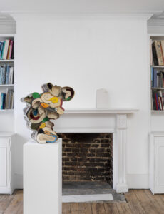 Jonathan Callan, ‘Rolling up the Empire of 1971’, Paper and screws, 64 x 55 x 30 cm, 2024
Jonathan Callan, ‘Model for a dog eared gravestone’, Crushed marble, lime, cement, 31.5 x 18 x 7 cm, 2024  
© Patrick Heide Contemporary Art, Photography by Marcus J. Leith